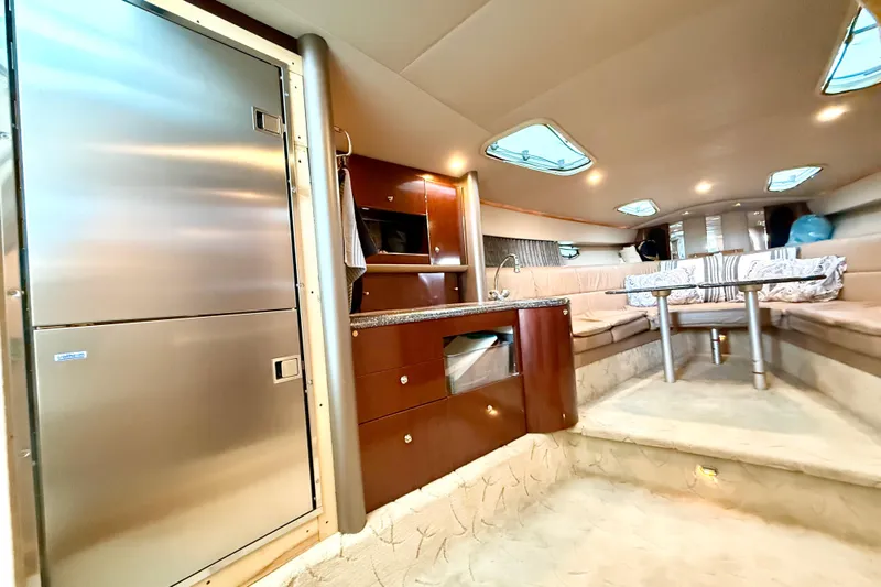 Obstreperous Yacht Photos Pics Luxurious interior of a 2004 Formula 400 Super Sport yacht with modern amenities.