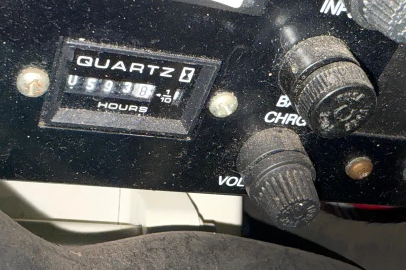 Obstreperous Yacht Photos Pics Close-up of a 2004 Formula 400 Super Sport hour meter and control knobs.
