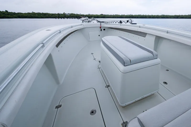  Yacht Photos Pics 2018 Yellowfin 36 Offshore boat interior with seating, on calm water.