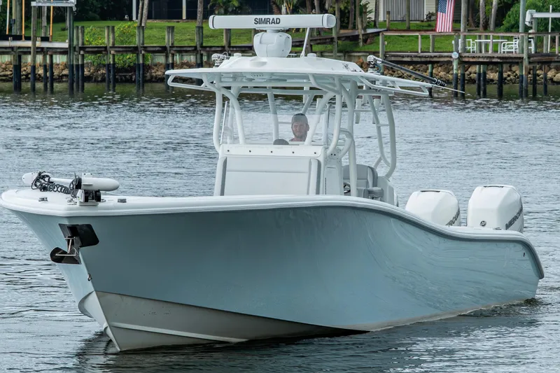  Yacht Photos Pics 2018 Yellowfin 36 Offshore boat on water, featuring dual engines and sleek design.