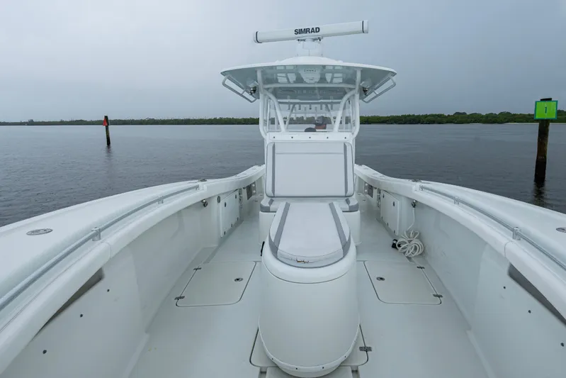  Yacht Photos Pics 2018 Yellowfin 36 Offshore boat on calm water, featuring spacious deck and modern design.