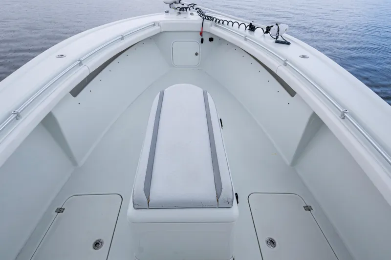  Yacht Photos Pics 2018 Yellowfin 36 Offshore boat interior with seating and storage, on calm water.