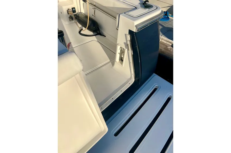 Blue Pearl Yacht Photos Pics 2005 Tiara Yachts 3200 Open, deck view with seating and storage area.