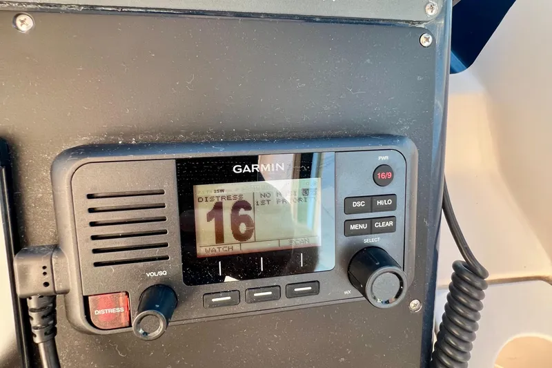 Blue Pearl Yacht Photos Pics Garmin marine radio on 2005 Tiara Yachts 3200 Open, displaying channel 16 distress signal.