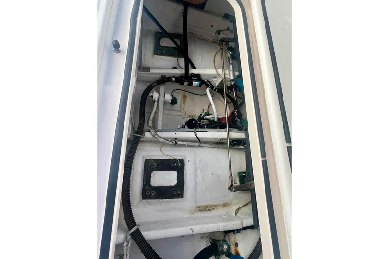 Blue Pearl Yacht Photos Pics Engine compartment of 2005 Tiara Yachts 3200 Open, showcasing mechanical components and wiring.