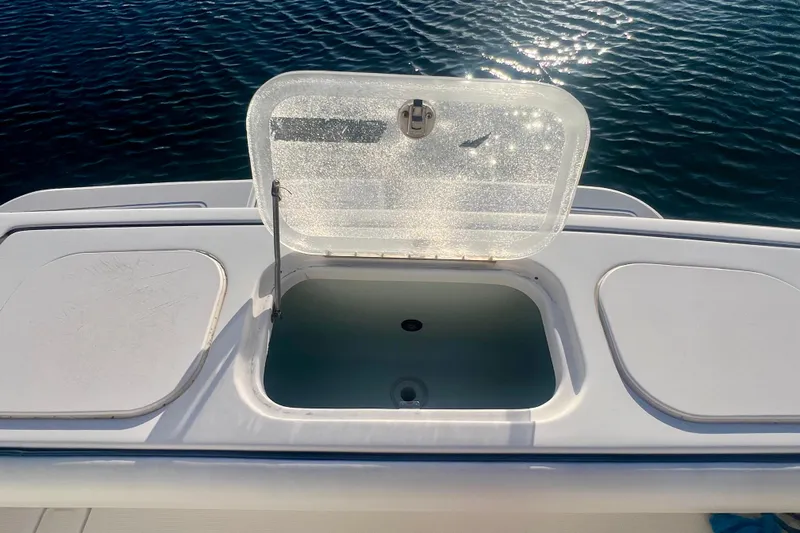 Blue Pearl Yacht Photos Pics Open hatch on 2005 Tiara Yachts 3200 Open, with water in the background.