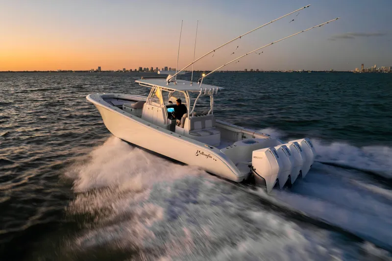  Yacht Photos Pics 2016 Yellowfin 39 Offshore boat cruising at sunset on open water.