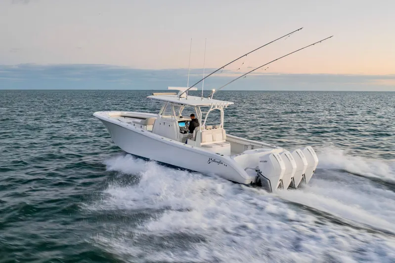  Yacht Photos Pics 2016 Yellowfin 39 Offshore boat cruising on open water at sunset.