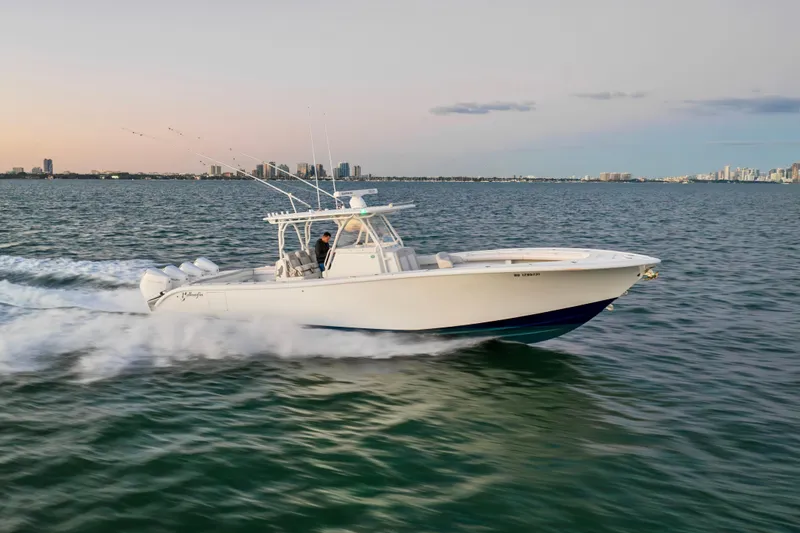  Yacht Photos Pics 2016 Yellowfin 39 Offshore boat cruising on open water at sunset.