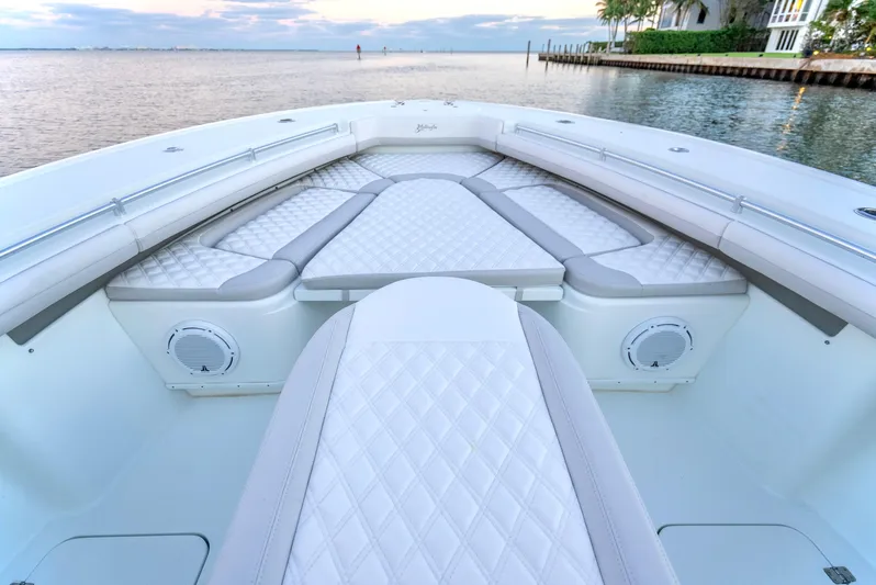  Yacht Photos Pics 2016 Yellowfin 39 Offshore boat with luxurious seating and waterfront view.