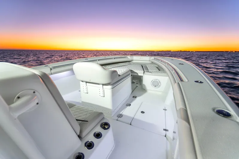  Yacht Photos Pics 2016 Yellowfin 39 Offshore boat at sunset on the ocean.