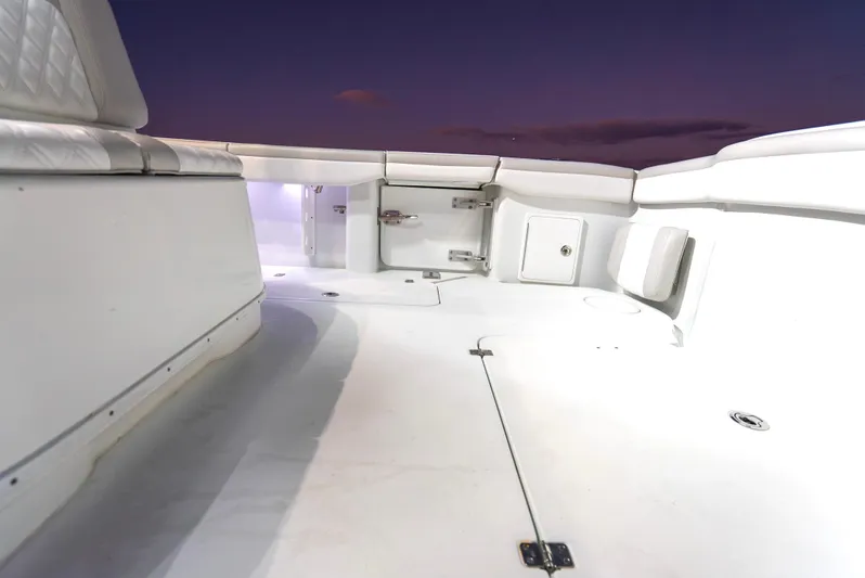  Yacht Photos Pics 2016 Yellowfin 39 Offshore boat deck at sunset, featuring spacious seating and storage.