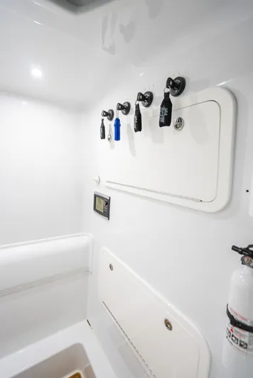  Yacht Photos Pics 2016 Yellowfin 39 Offshore interior with fishing rod holders and storage compartments.