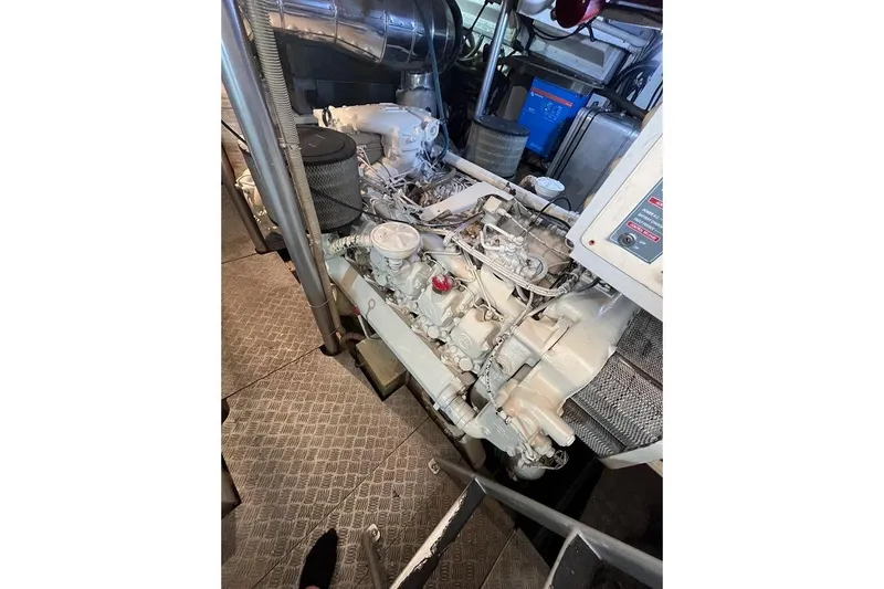  Yacht Photos Pics Engine room of a 1998 Riva Dolce Vita yacht, showcasing mechanical components.