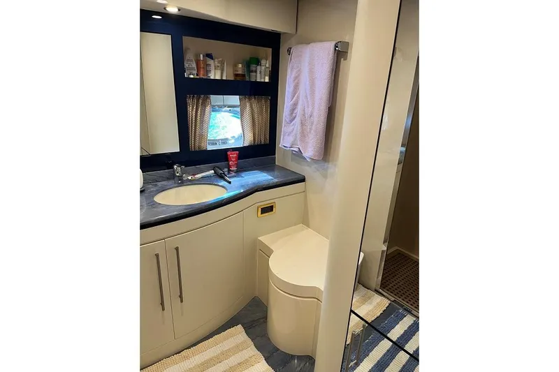  Yacht Photos Pics Luxurious 1998 Riva Dolce Vita yacht bathroom with modern amenities and elegant design.