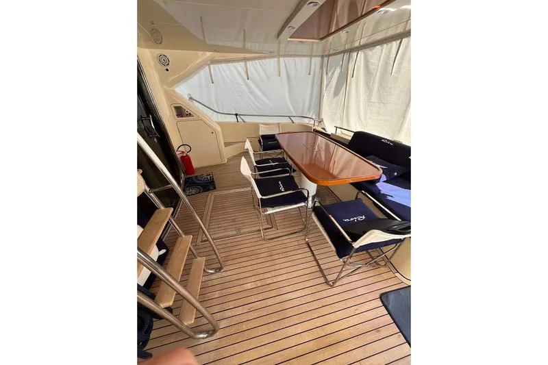  Yacht Photos Pics Interior of 1998 Riva Dolce Vita yacht with wooden flooring and seating area.