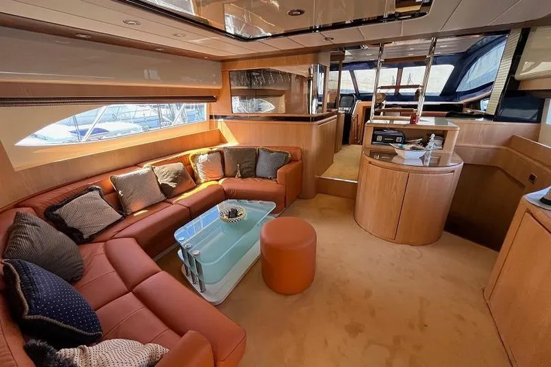  Yacht Photos Pics Luxurious interior of a 1998 Riva Dolce Vita yacht with elegant seating and modern design.