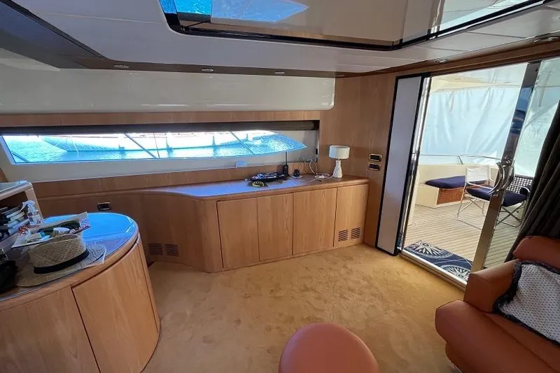  Yacht Photos Pics Luxurious interior of a 1998 Riva Dolce Vita yacht with elegant wood finishes.