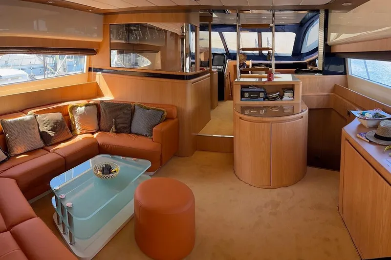  Yacht Photos Pics Luxurious interior of a 1998 Riva Dolce Vita yacht with elegant seating and modern decor.
