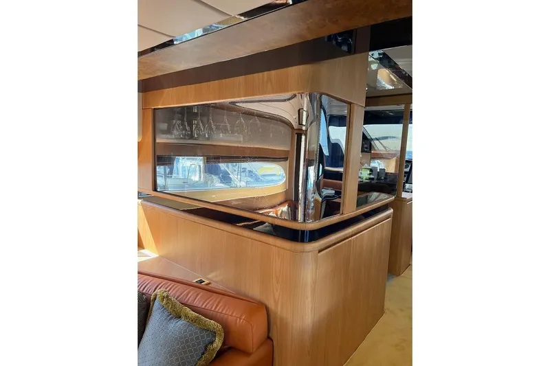  Yacht Photos Pics Luxurious interior of a 1998 Riva Dolce Vita yacht with elegant wood finishes.