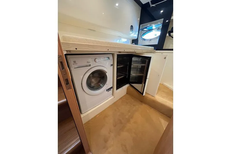  Yacht Photos Pics Laundry and mini fridge area inside 1998 Riva Dolce Vita yacht.