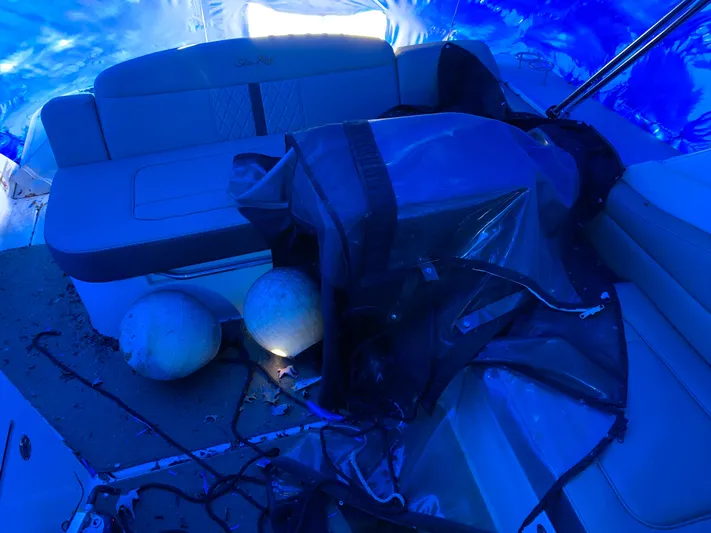  Yacht Photos Pics 2017 Sea Ray Sundancer 310 interior with seating and marine equipment under blue tarp.