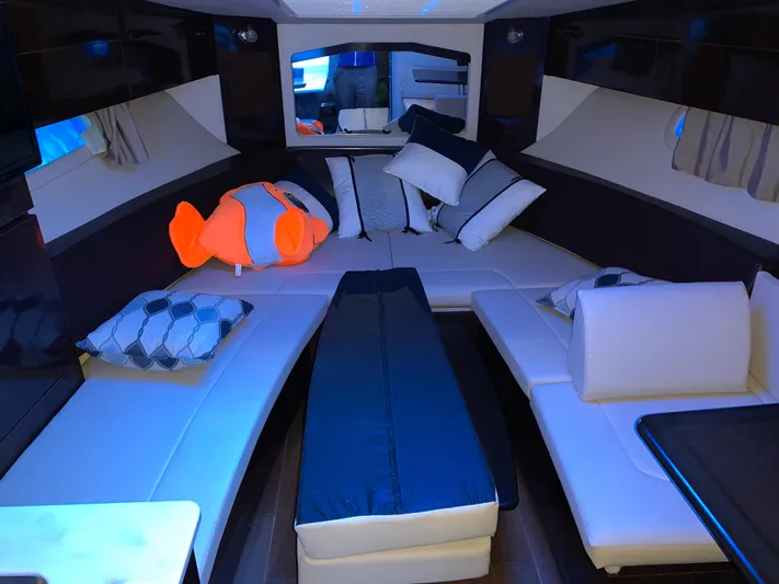  Yacht Photos Pics 2017 Sea Ray Sundancer 310 cabin interior with plush seating and decorative pillows.