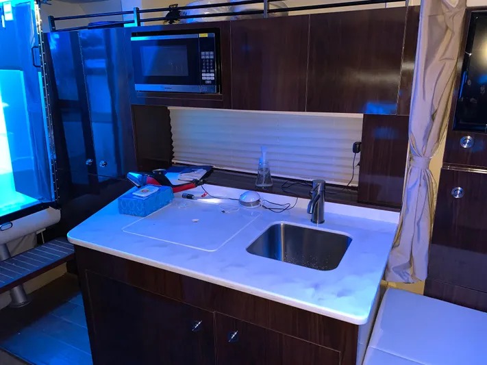  Yacht Photos Pics 2017 Sea Ray Sundancer 310 galley with sink, microwave, and storage cabinets.
