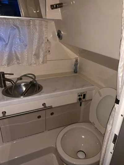  Yacht Photos Pics 2017 Sea Ray Sundancer 310 bathroom with sink, toilet, and storage cabinets.