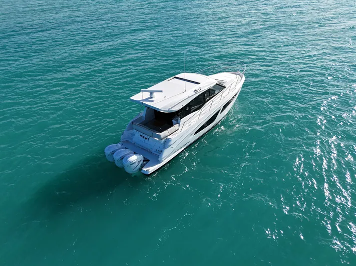  Yacht Photos Pics 2022 Regal 42 XO yacht cruising on turquoise waters.