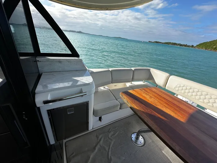  Yacht Photos Pics Luxurious 2022 Regal 42 XO yacht interior with ocean view and elegant seating area.