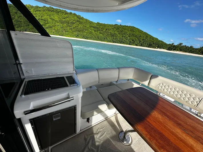  Yacht Photos Pics Luxurious 2022 Regal 42 XO yacht interior with ocean view and seating area.