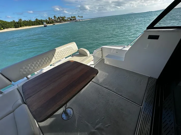  Yacht Photos Pics Regal 42 XO 2022 yacht deck with ocean view and seating area.