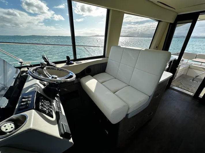  Yacht Photos Pics Interior of 2022 Regal 42 XO yacht with ocean view through windows.