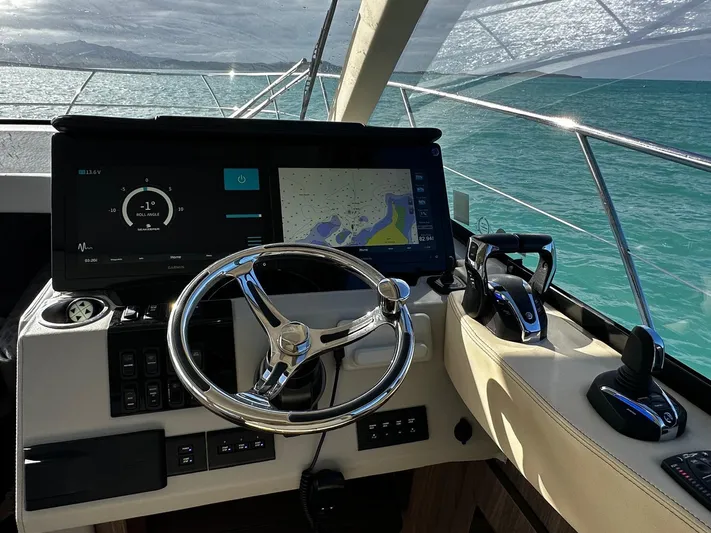  Yacht Photos Pics Regal 42 XO 2022 yacht helm with modern navigation system and ocean view.