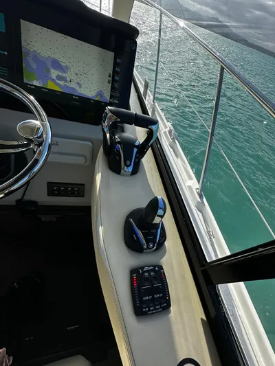  Yacht Photos Pics 2022 Regal 42 XO helm with navigation controls and sea view.