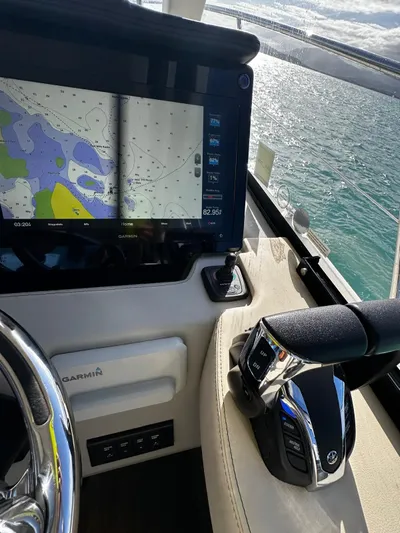  Yacht Photos Pics 2022 Regal 42 XO yacht helm with navigation display and controls.