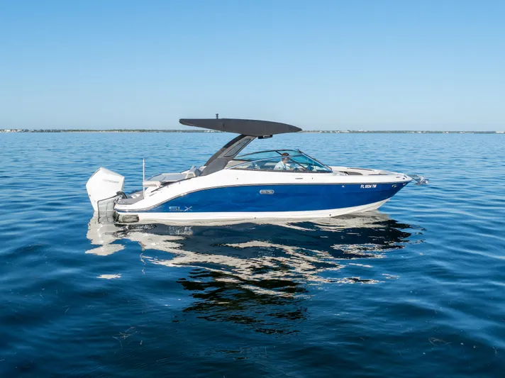  Yacht Photos Pics 2023 Sea Ray SLX 260 Outboard boat on calm blue water.