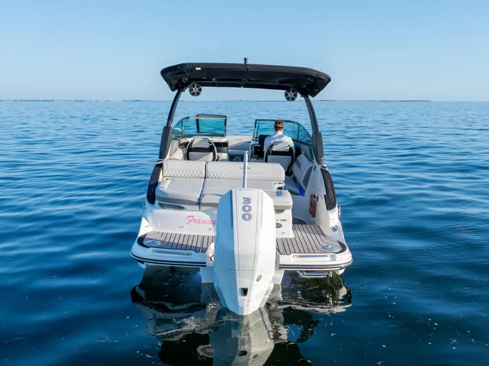  Yacht Photos Pics 2023 Sea Ray SLX 260 Outboard boat on calm water, rear view.