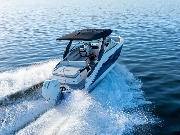  Yacht Photos Pics 2023 Sea Ray SLX 260 Outboard cruising on open water, showcasing sleek design and performance.