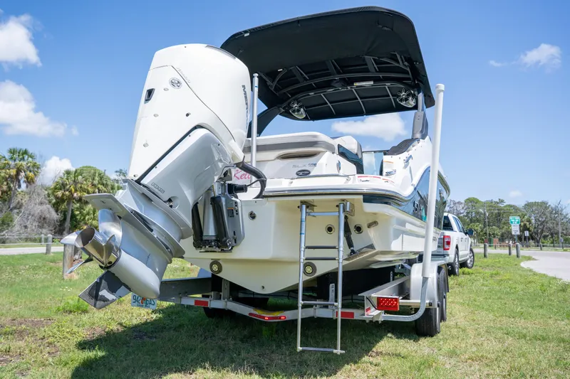  Yacht Photos Pics 2023 Sea Ray SLX 260 Outboard boat on trailer, rear view, sunny day.