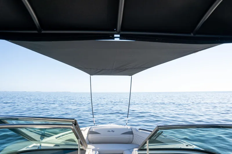  Yacht Photos Pics 2023 Sea Ray SLX 260 Outboard boat with canopy on open water.