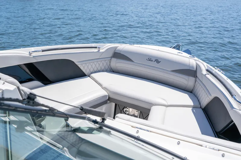  Yacht Photos Pics 2023 Sea Ray SLX 260 Outboard boat with luxurious seating on calm water.