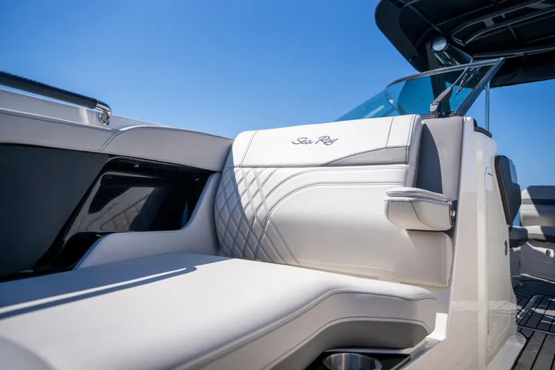  Yacht Photos Pics 2023 Sea Ray SLX 260 Outboard luxury seating detail under clear blue sky.