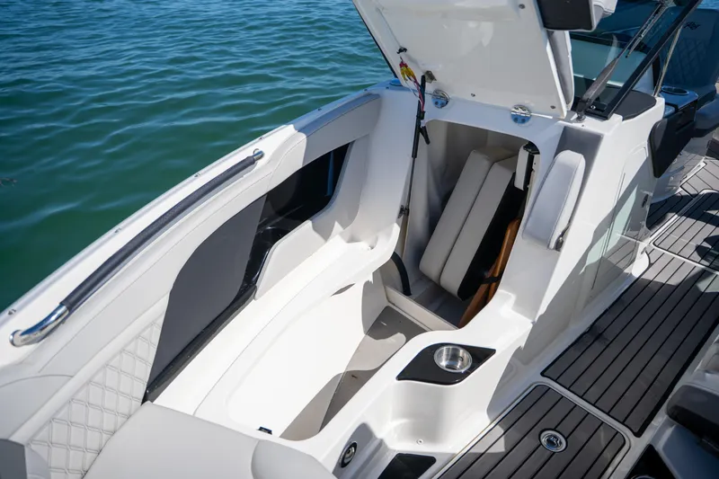  Yacht Photos Pics 2023 Sea Ray SLX 260 Outboard boat interior with open storage compartment.