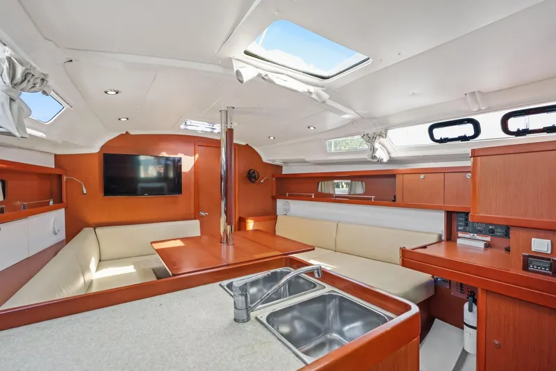 Americana Yacht Photos Pics Interior of 2014 Beneteau Oceanis 37 yacht with modern furnishings and ample natural light.
