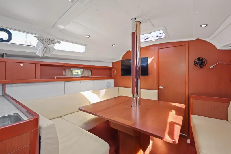Americana Yacht Photos Pics Interior of 2014 Beneteau Oceanis 37 sailboat with modern seating and wooden finishes.