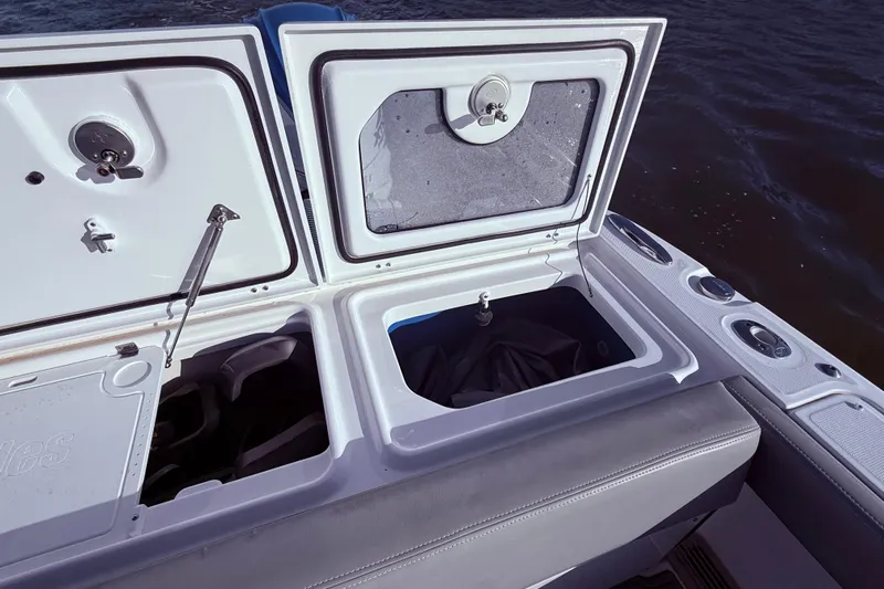  Yacht Photos Pics 2023 Everglades 395 Center Console boat storage compartments open on the water.