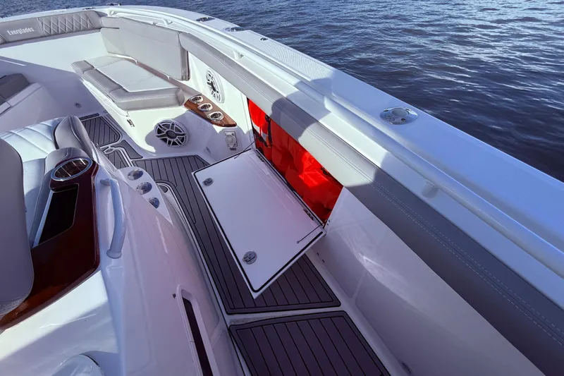  Yacht Photos Pics 2023 Everglades 395 Center Console boat interior with seating and storage compartments.