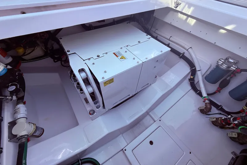  Yacht Photos Pics Engine compartment of 2023 Everglades 395 Center Console boat, showcasing mechanical components.